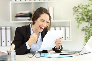 Young woman excited about her pay raise